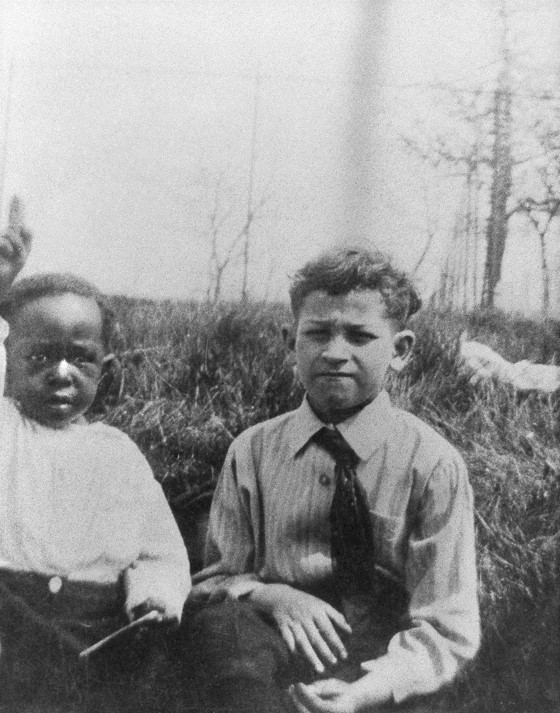 Charlie and Ike as young children sitting outdoors